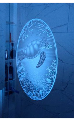 Customer supplied photo of the sea turtle decal on a shower door basked in blue light.